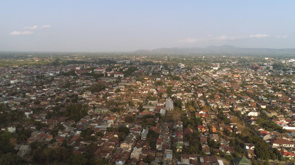 Obraz premium aerial view yogyakarta city cultural capital indonesia located on java island. Yogyakarta with buildings, highway at sunset time. aerial view