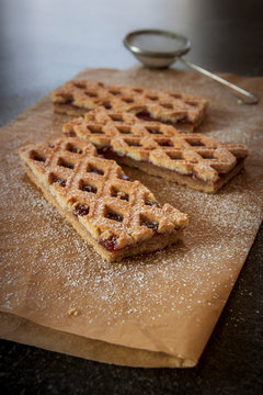Linzer Torte is traditional Austrian cake with a lattice design on top of the pastry. Filled with jam.