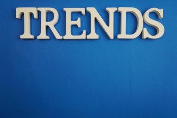 Trends  word alphabet letters on blue background