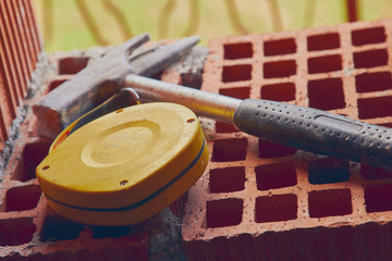 Construction tool on a brick.