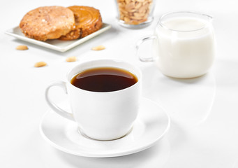 cup of coffee and croissant on table