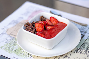 Granola with chocolate and strawberry.