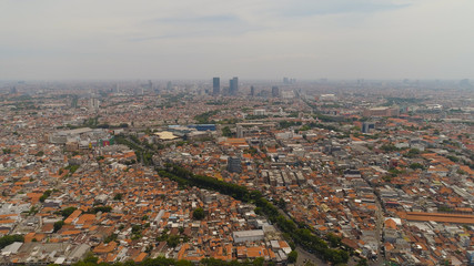 Aerial cityscape modern city Surabaya with skyscrapers, buildings and houses. urban environment in asia city skyline with skyscrapers and business centers java, indonesia