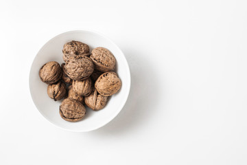 Useful walnuts, close-up, isolated on white background.