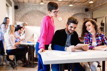 Business people and architects collaborating on project