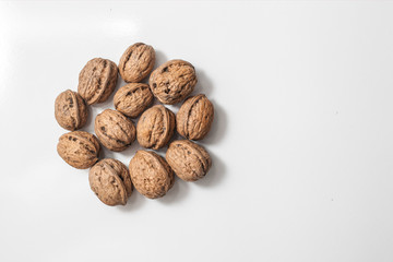 Useful walnuts, close-up, isolated on white background.