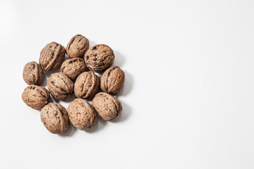 Useful walnuts, close-up, isolated on white background.