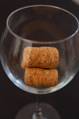 wine corks in a glass goblet