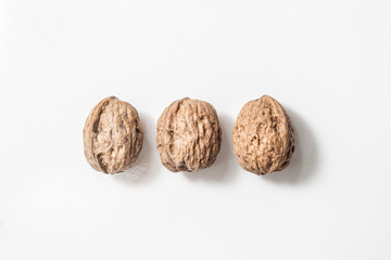 Useful walnuts, close-up, isolated on white background.