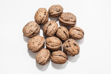 Useful walnuts, close-up, isolated on white background.