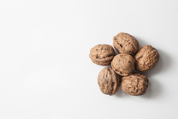Useful walnuts, close-up, isolated on white background.