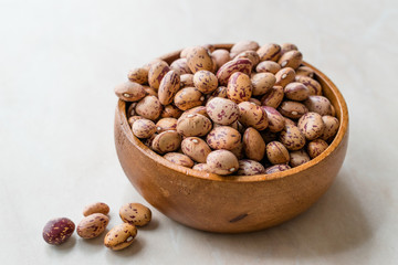 Raw Dry Pinto Beans on Marble Board with Wooden Bowl / Kidney Beans.