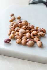 Raw Dry Pinto Beans on Marble Board / Kidney Beans.
