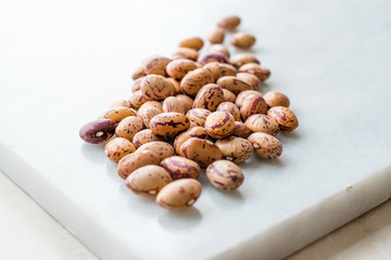 Raw Dry Pinto Beans on Marble Board / Kidney Beans.
