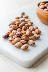 Raw Dry Pinto Beans on Marble Board / Kidney Beans.