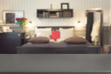 Blurred modern bedroom as background with tabletop for display your products.