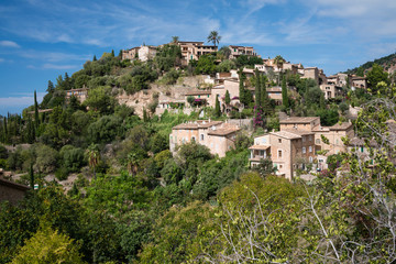 Fototapeta na wymiar A beautiful village of traditional ochre-coloured houses near the Teix mountain on the west coast of Mallorca island, Spain