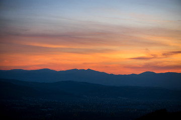 Romantic, bright and colorful sunset over a mountain range in Transylvania. Beautiful, colorful autumn background.  