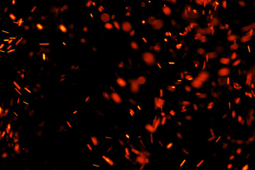 flame of fire with sparks on a black background