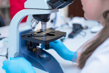 Laboratory assistant with a microscope. Medical laboratory for the study of analyzes