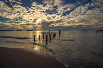 The background of the sea waves that come from the wind at the beach and the sky and beautiful morning, seen from travel or tourist attractions