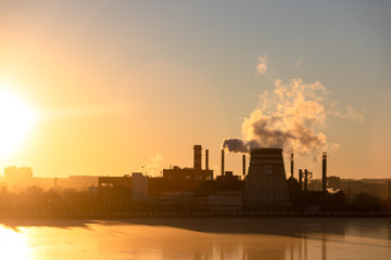 Type of industrial pipes from which smoke. Industrial waste pollutes the atmosphere of the earth