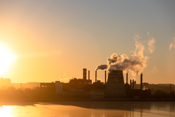 Fototapeta premium Type of industrial pipes from which smoke. Industrial waste pollutes the atmosphere of the earth