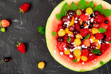 Watermelon bowl with cottage cheese and berries