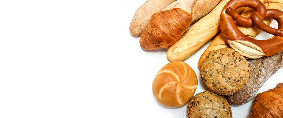 Varied pastries, bread, pretzel, baguette, croissant, buns close up isolated on white background...