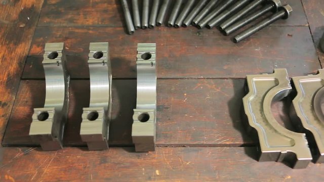 Parts of a car engine in a car repair factory. Spare parts for car engine slider shoot