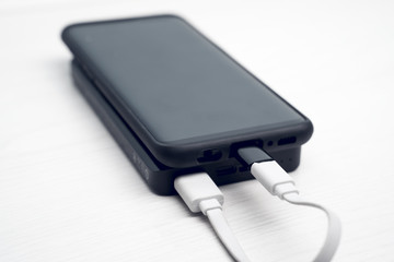 Photo of black powerbank on white surface