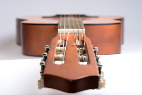 Fretboard of old classical guitar. Stringed musical instrument