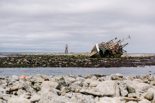 Wreck of Banff Fishing Vessel boat BF 380 aground on rocks at Fraserburgh, North East Scotland, UK