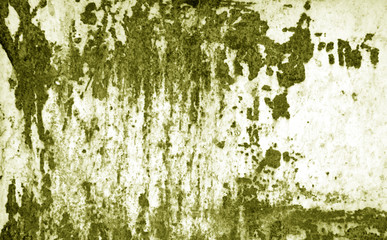 Grungy rusted metal surface in yellow tone.