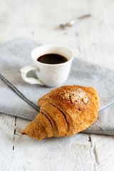 Breakfast with coffee and croissant