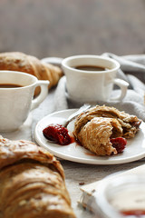 Breakfast with coffee and croissant