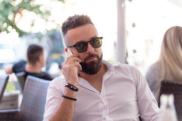 Businessman talking on mobile phone.