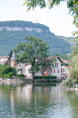 Obraz premium Ornans France 09-15-2018. Houses on river la Loue in Ornans France