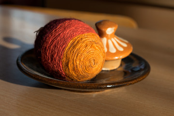 Wicker easter egg on a clay plate
