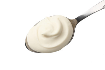 sour cream in spoon isolated on white background