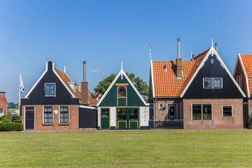 Fototapeta na wymiar Traditional dutch houses in Oudeschild, Netherlands