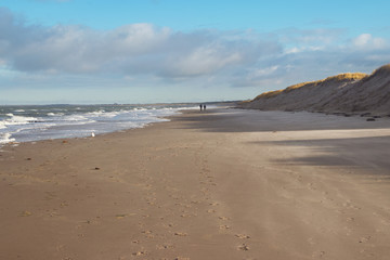 people walking at coast,baltic sea in winter