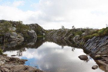 stone shore of lake in mountains
