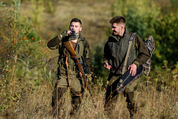 Man hunters with rifle gun. Boot camp. Hunting skills and weapon equipment. How turn hunting into...
