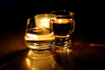 beautiful glasses in the flame of a candle