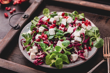 fresh winter salad with pomegranate seeds