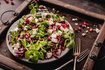 fresh winter salad with pomegranate seeds