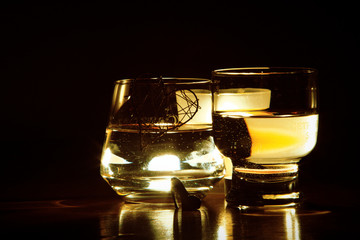 beautiful glasses in the flame of a candle