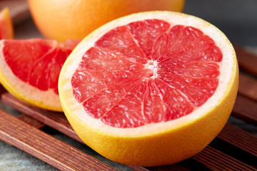 Fresh raw grapefruit (citrus x paradisi) on wooden background