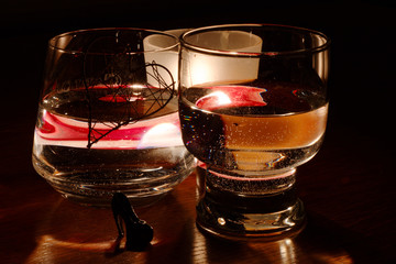 beautiful glasses in the flame of a candle